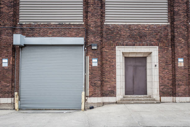 istock Garage decorative door with brick wall 960988580