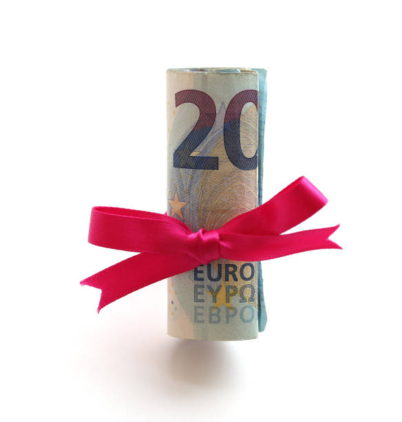 istock Roll of money wrapped up as a gift 960989416