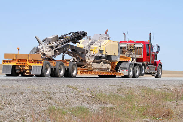 istock Semi Flatbed Truck Transporting A Portable Drilling Rig 960994466