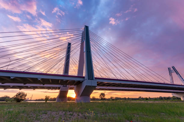 istock Cable stayed bridge over Vistula river, Krakow, Poland, beautiful colorful sunset 960998646