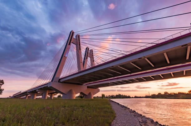 istock Cable stayed bridge over Vistula river, Krakow, Poland, beautiful colorful sunset 960998704