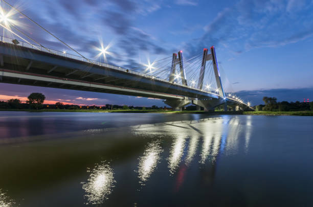 istock modern bridge over Vistula river, Krakow, Poland, illuminated in the night 960998830