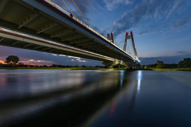 istock modern bridge over Vistula river, Krakow, Poland, illuminated in the night 960998854