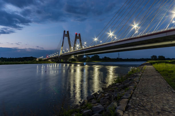 istock modern bridge over Vistula river, Krakow, Poland, illuminated in the night 960998864
