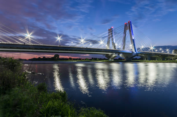 istock modern bridge over Vistula river, Krakow, Poland, illuminated in the night 960998880