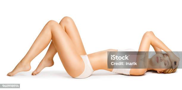 Body Beauty Slim Woman In Cotton Underwear Lying Down On Back Happy Dreaming Girl White Isolated Stock Photo - Download Image Now