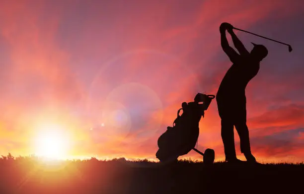 Photo of Golfer Silhouette During Sunset With Copy Space