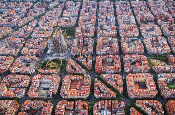 istock Aerial view of Barcelona Eixample residencial district with typical urban grid, Spain 961003978