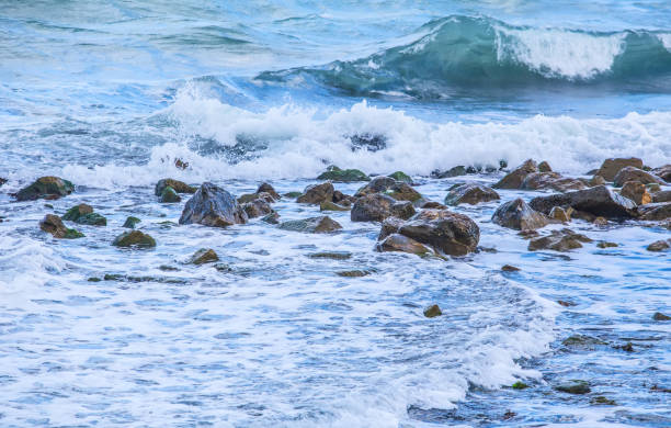 istock Waves, foam, spray and stones 961007506