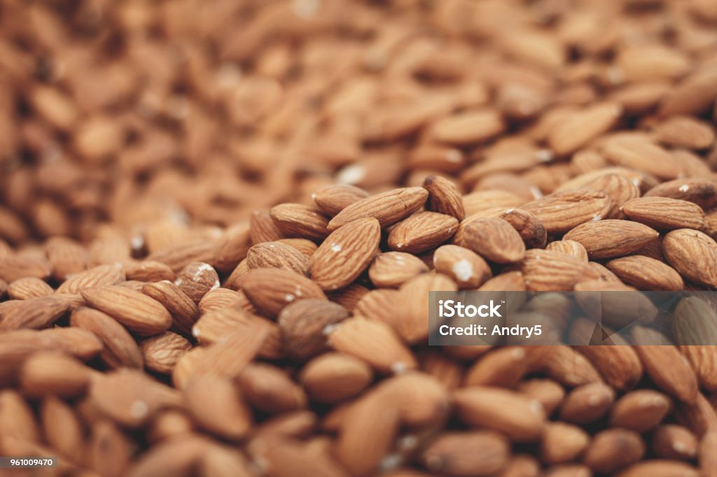 Thousands of almonds Background of a big hill of roasted almonds, captured on Sunday market in the downtown of Istanbul Almond Stock Photo