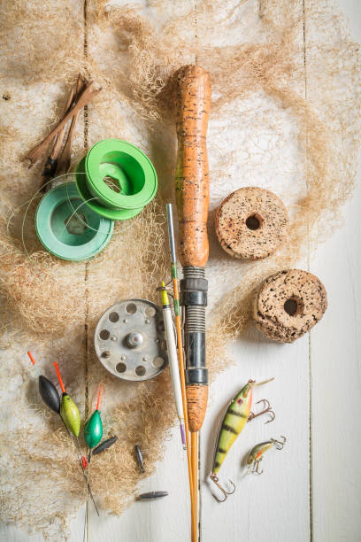 istock Tackle fishing with floats, rods and hooks on white table 961021886
