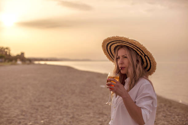 istock Young caucasian woman enjoying at the beach 961026820