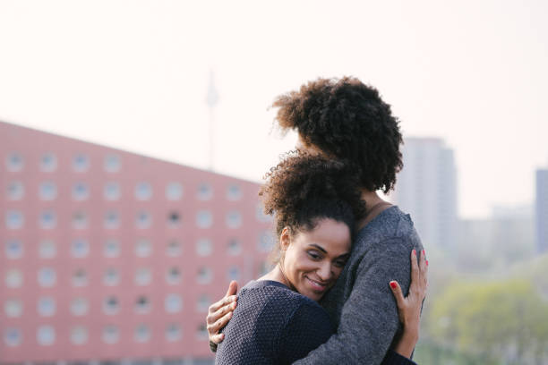 istock Young couple on a rooftop terrace at sunset 961034814