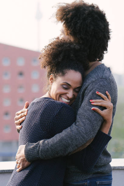 istock Young couple on a rooftop terrace at sunset 961034918