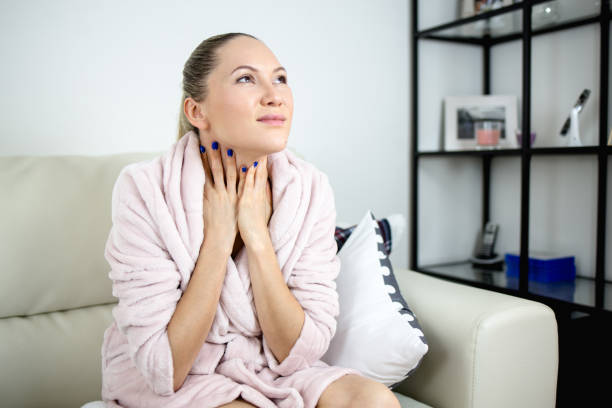 istock Young Woman with sore throat 961035006