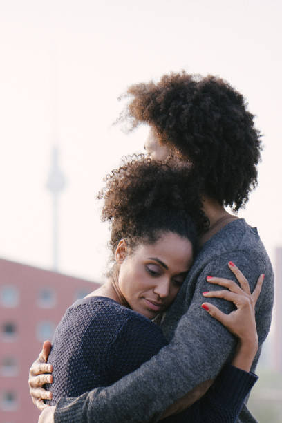 istock Young couple on a rooftop terrace at sunset 961035734