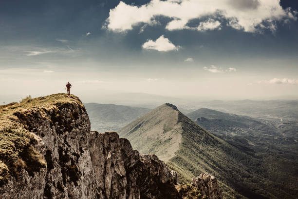 istock Man on top of a mountain 961039908