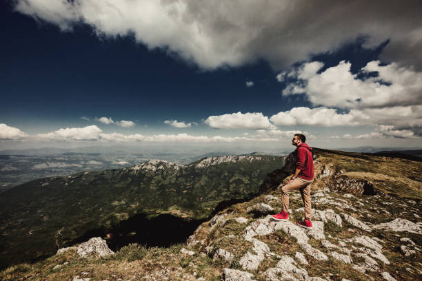 istock Man on top of a mountain 961040332