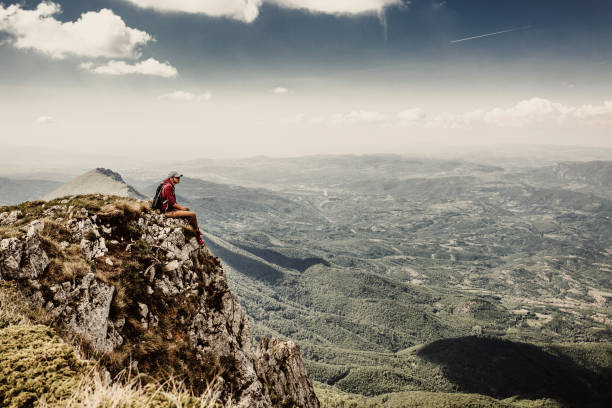 istock Man on top of a mountain 961040340