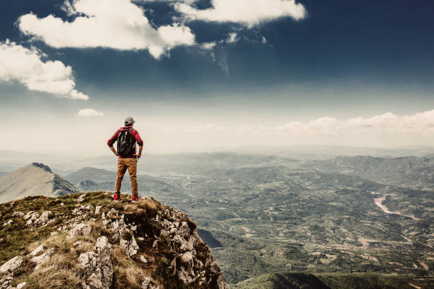 istock Man on top of a mountain 961042736