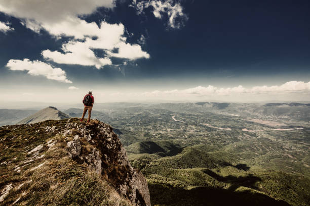 istock Man on top of a mountain 961042776