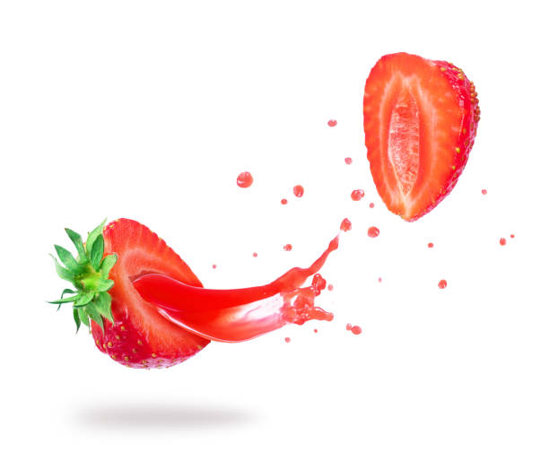 istock Strawberry cut into two halves with flowing juice close-up 961050506