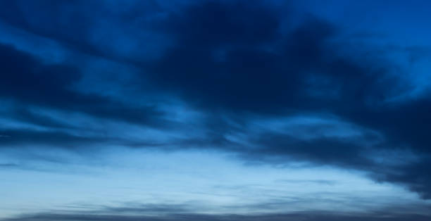 istock dark blue clouds in the sky at night 961066540