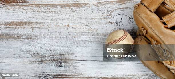 Flat Lay View Of Old Baseball And Mitt On White Rustic Wooden Boards Stock Photo - Download Image Now