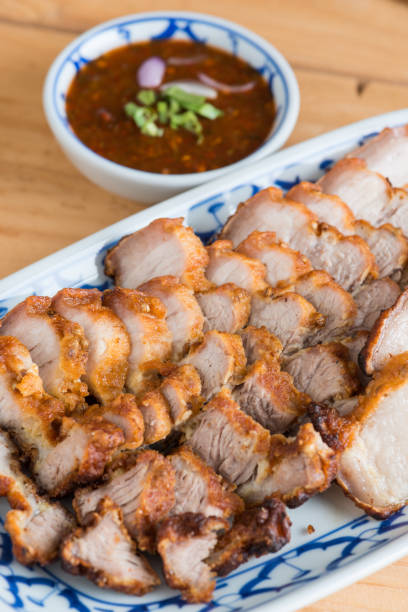 istock Deep Fried Crispy Pork Belly Cooked with Garlic and spicy dipping sauce 961080228