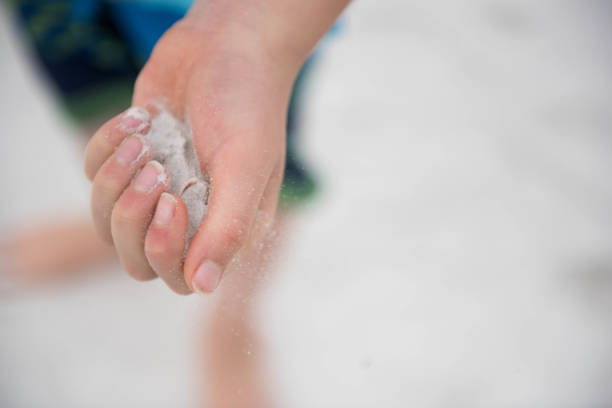 Child on vacation on the gulf of Mexico enjoying the sand, hotel, and water slides.
