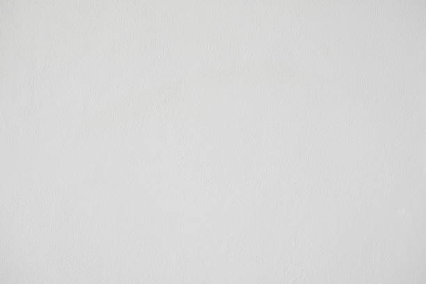 istock White painted concrete wall surface, material for decoration background texture, interior design. 961080900