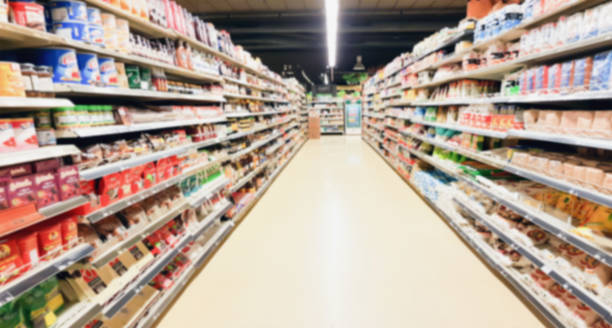 istock supermarket aisle interior blurred background 961080998