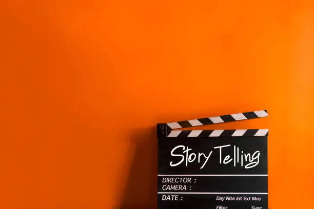 Photo of Story Telling,text title on film Clapperboard