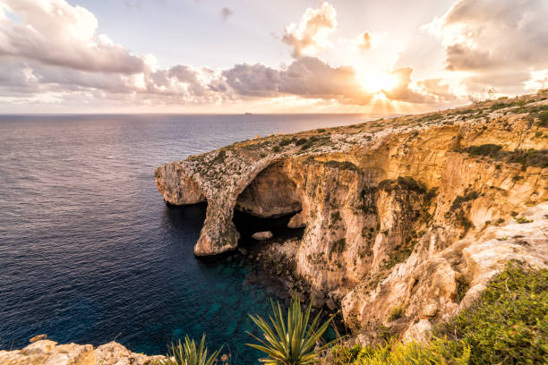 istock Sunset over the Blue Grotto.  Arch in Malta, Europe 961081830