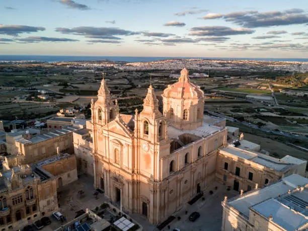 Aerial drone photo - St. Paul's Cathedral at sunset in the ancient medieval city of Mdina, Malta.