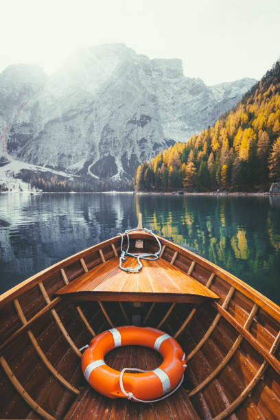 istock Traditional rowing boat on a lake in the Alps in fall 961096126