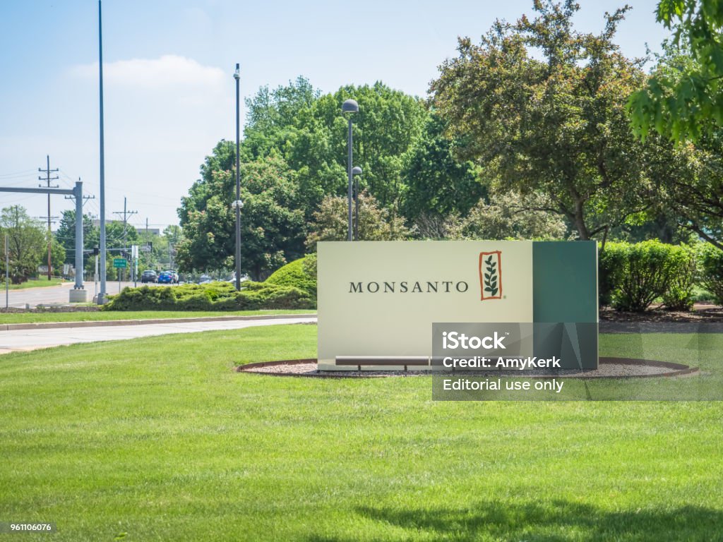 Monsanto corporate headquarters sign SAINT LOUIS, UNITED STATES - May 16, 2018: Monsanto sign at entrance to corporate headquarters at Creve Coeur campus before Bayer takeover buyout Herding Stock Photo