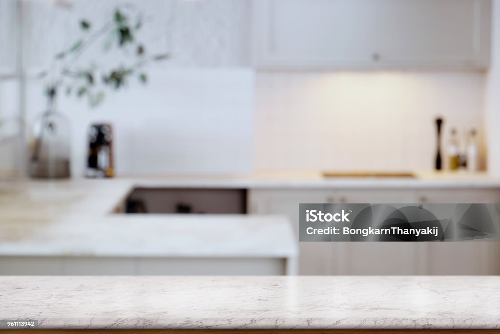 Empty white marble  table top and  kitchen background. for food and product display montage Table Stock Photo