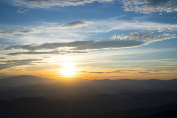 istock Panoramic scenery of mountains at sunset 961122838
