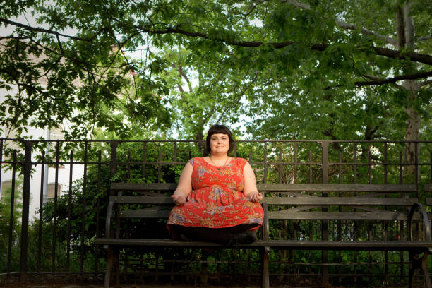 istock Brown-haired woman with bangs in park 961127170