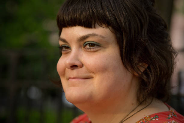 istock Brown-haired woman with bangs in park 961127690