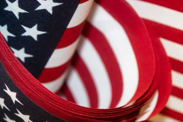 Photo of Red white and blue American flags background - selective focus