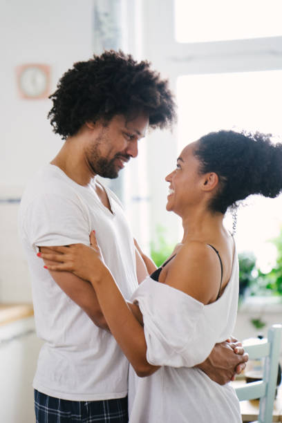 istock Young beautiful couple in the kitchen 961163022