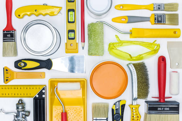 istock different painting tools and accessories on white wooden desk. house renovation tools. 961166802
