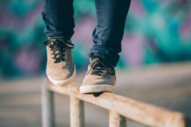 istock Legs walking on steel pipe with balance 961167534