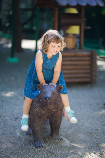 istock Little girl in the zoo. 961171798