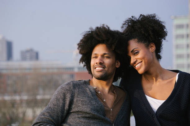 istock Young couple on a rooftop terrace at sunset 961171870