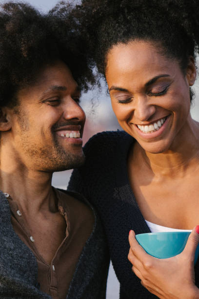 istock Young couple on a rooftop terrace at sunset 961172550
