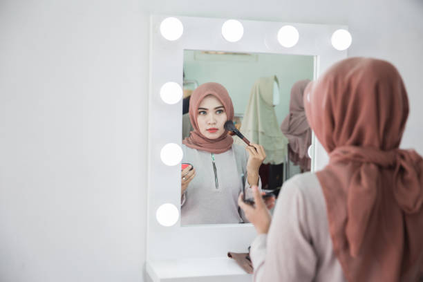 istock muslim woman applying makeup 961173814