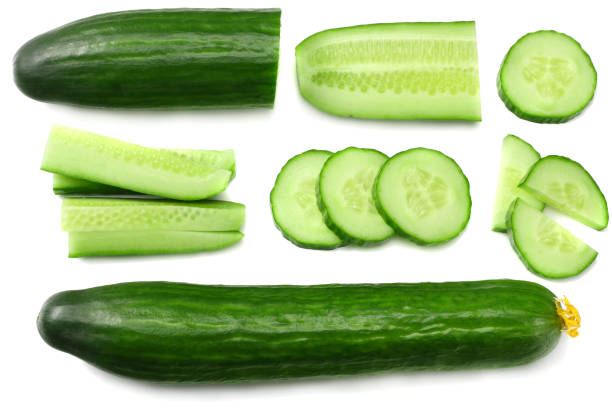istock fresh cucumber slices isolated on white background. top view 961178486